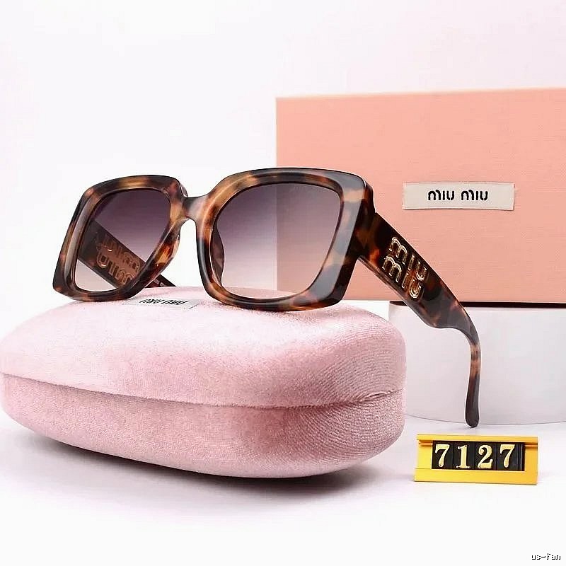 Miu Miu Relaxed Oversized sunglasses Black Oval Sunglasses with Designer-Inspired Detail